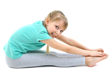 Fototapeta na wymiar Little girl doing exercises isolated on white
