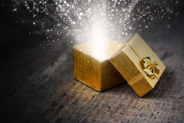 Magical gift with rays and sparks