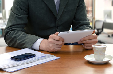 Businessman using the tablet ps at office