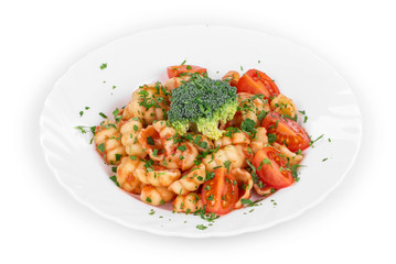 Close up of shells pasta with vegetables.