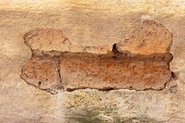 The old cracked wall of the abandoned ruins.
