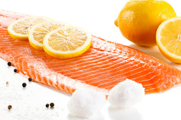 Raw salmon fillet on white background
