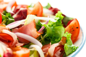Smoked ham and vegetables on white background