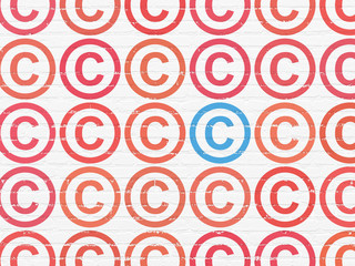 Law concept: copyright icon on wall background