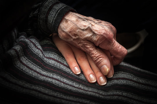 Aged Hand Holding Young Hand