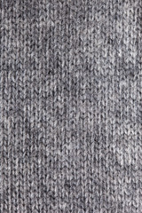 Gray knitted vertical textured background