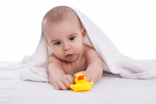 Babies joyful moments with toys after bath