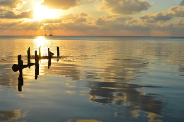 Fototapeta premium Sunset in the Caribbean sea by Caye Caulker island, Belize