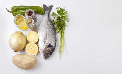 Raw sea bream fish with some ingredients