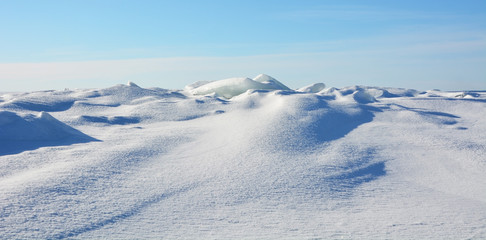 Fototapeta na wymiar Polar landscape- frozen sea with blue sky background