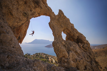 Rock climber falling of a cliff while lead climbing. Kalymnos Island, Greece