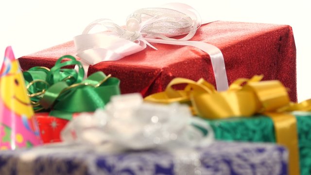 Lot of boxes, gifts tied with ribbons and bows isolated on white