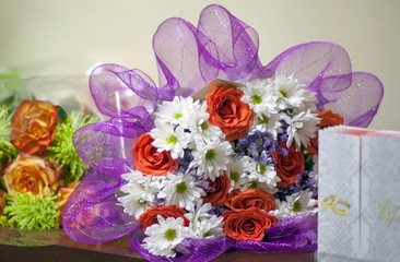 Festive bouquets and greeting card on the table.