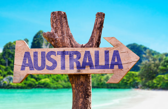 Australia wooden sign with beach background