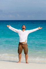 happy young man on the beach