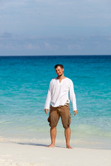 happy young man on the beach