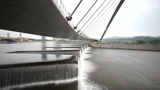 Water Flow At Putrajaya Dam Below Pedestrian Bridge