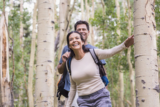 Couple walking together in forest
