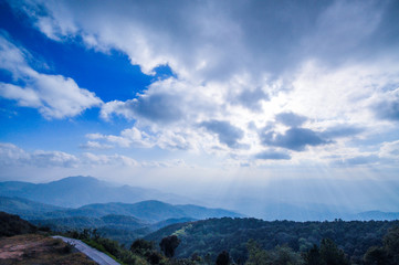 Bright sky with beautiful sunlight with road and mountain