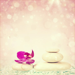 Fototapeta na wymiar Spa stones and pink flower
