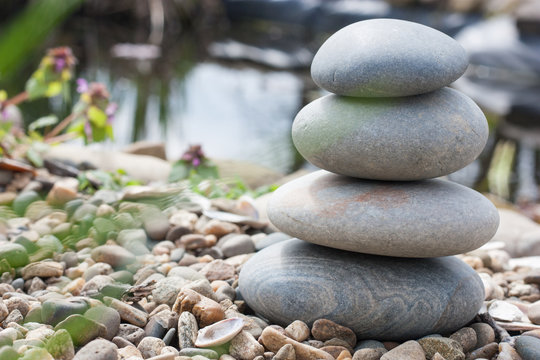 Stone pyramid on the lake's shore