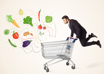 Businessman with shopping cart with vegetables