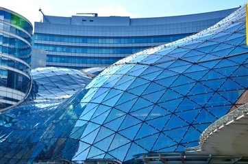 Abstract facade lines and glass reflection on modern building