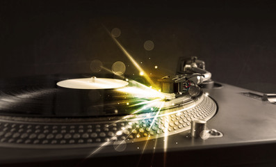 Music player playing vinyl with glow lines comming from the need