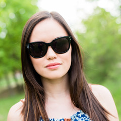 Summer girl portrait. Asian woman smiling happy on sunny summer 