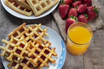 Waffles covered with maple syrup