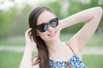 Summer girl portrait. Asian woman smiling happy on sunny summer 