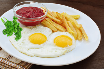 Sunny side up with fries and ketchup
