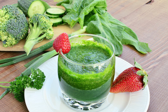 Green vegetable smoothie with strawberries
