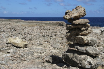 Fototapeta na wymiar Stack of stones near ocean