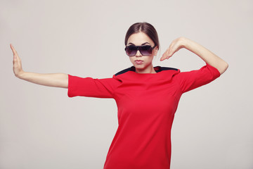 Girl in a red dress and sunglasses