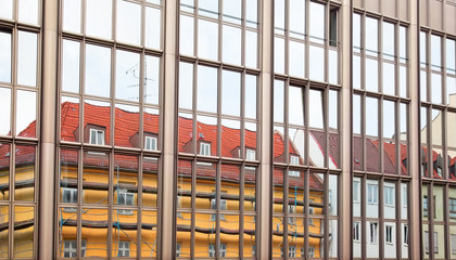 Old building architecture reflected in modern building