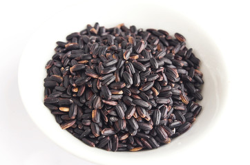 Black rice in a white background