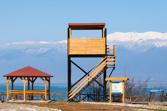 Wooden kiosk, watchtower and informative billboard at a wetland