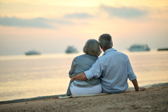  Mature couple relaxing on beach