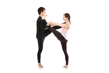Fototapeta na wymiar Acro yoga extended hand-to-big-toe pose