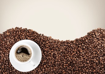Coffee. Cup of coffee on beans