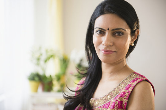 Indian woman wearing bindi and traditional garb