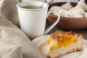 Shortcrust peach pie and cup of tea