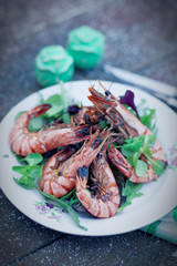 Grilled shrimps served outdoor in winter, toned image