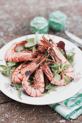 Grilled shrimps served outdoor in winter, toned image