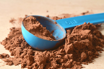 Scoop in brown powder