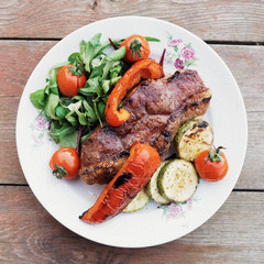 New York steak with vegetables, toned image
