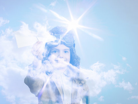 Portrait Of Child With Airplane Traveling Toy In Double Exposure