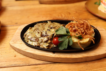 Pork chops baked with onions