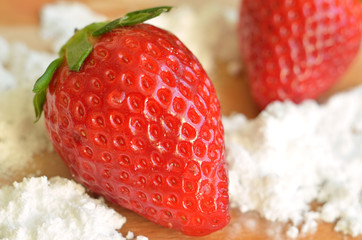 Detail of fresh strawberries and icing sugar